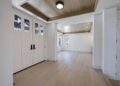 Mid-sized transitional light wood floor entryway photo in San Francisco with white walls and a white front door